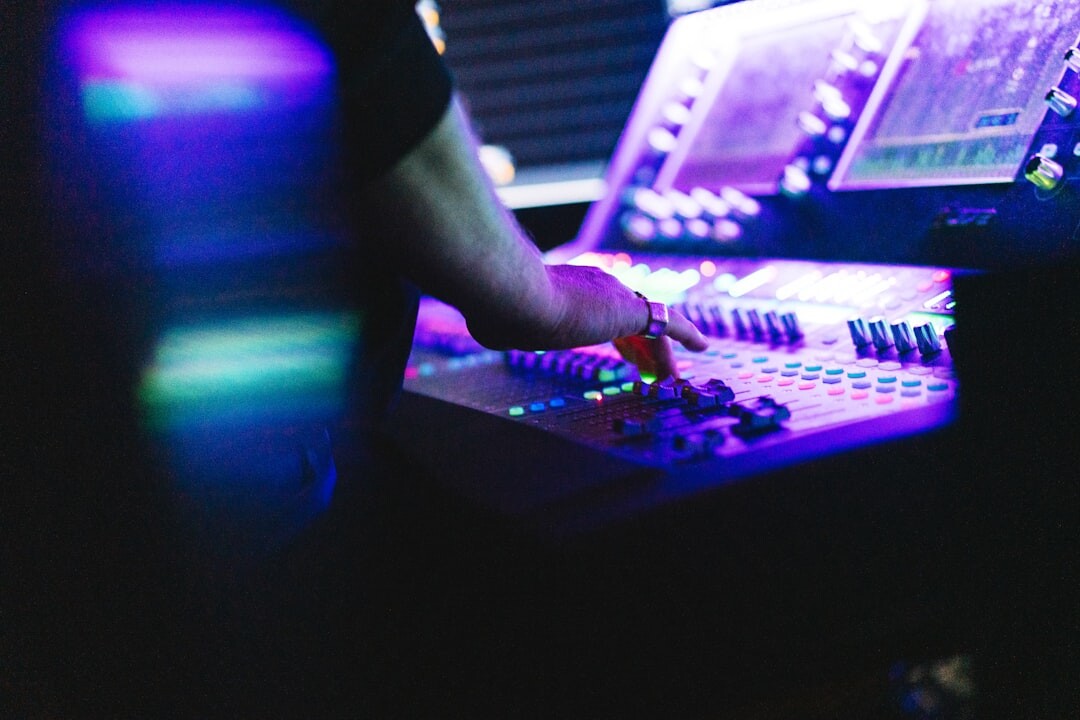 Lighting technician adjusting a lighting console