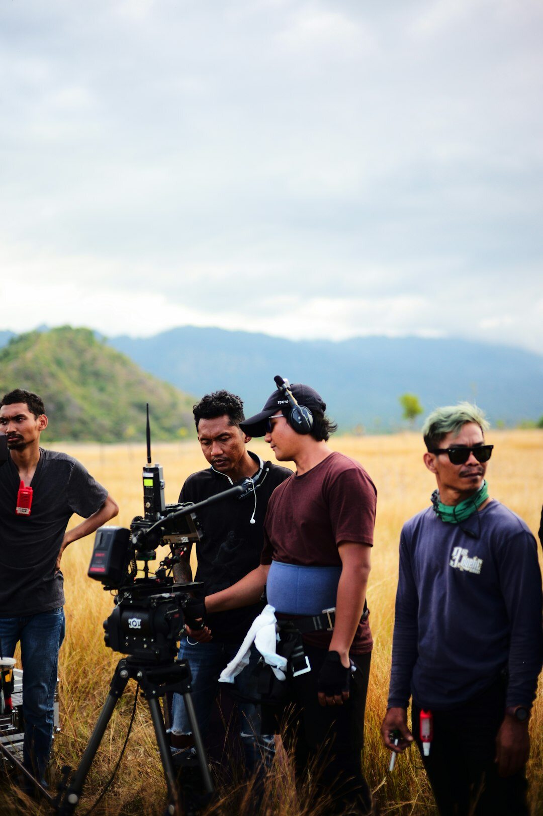 Team of television production professionals standing together